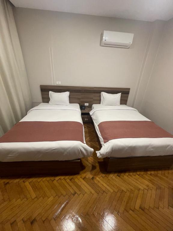 Postel nebo postele na pokoji v ubytování New Lotus Hotel