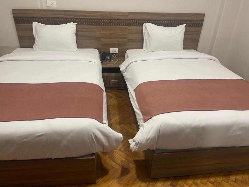 Postel nebo postele na pokoji v ubytování New Lotus Hotel