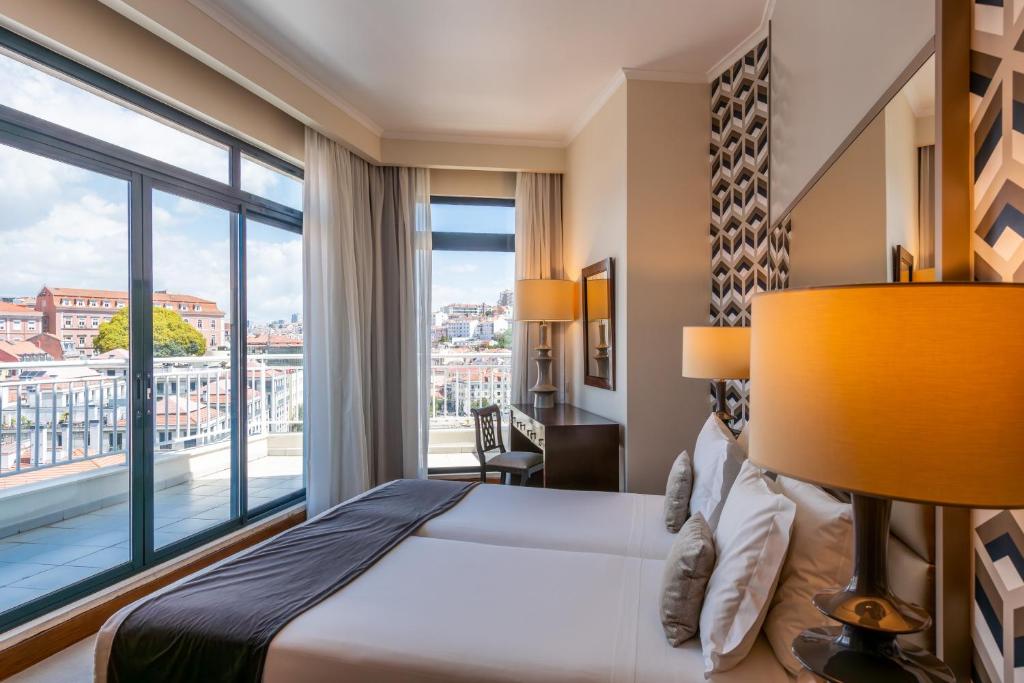 Ein Bett oder Betten in einem Zimmer der Unterkunft Hotel Mundial