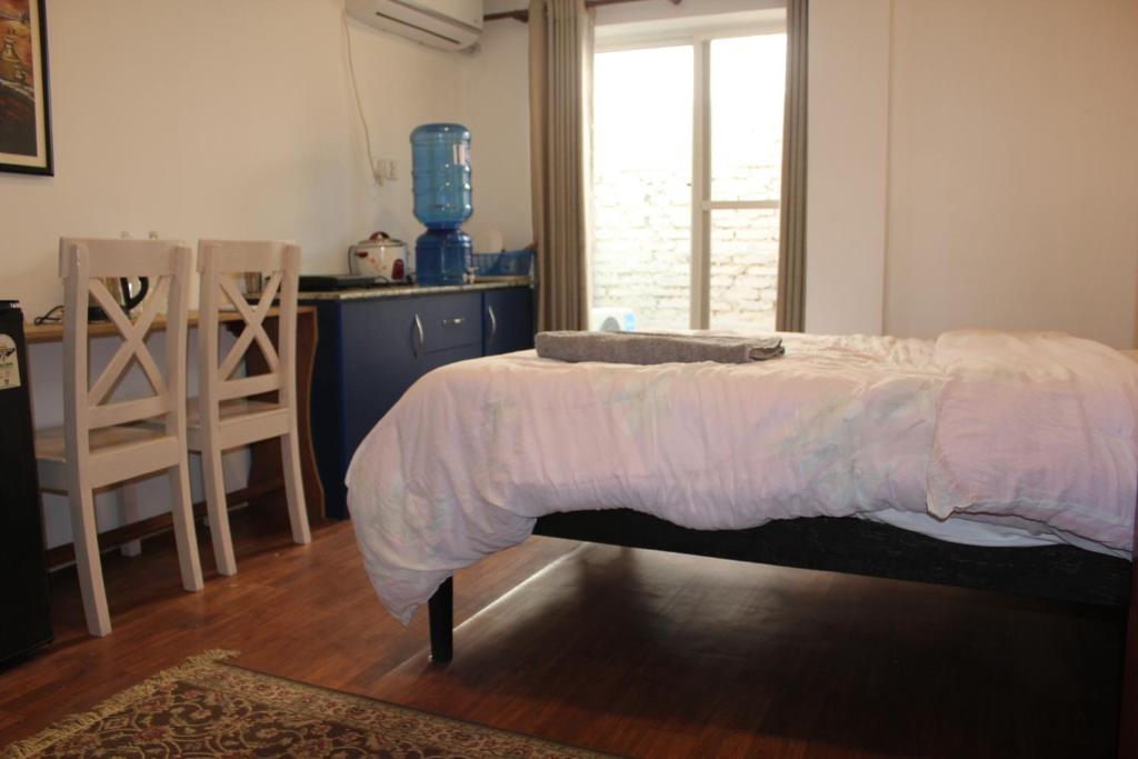 Postel nebo postele na pokoji v ubytování KAJI HOME