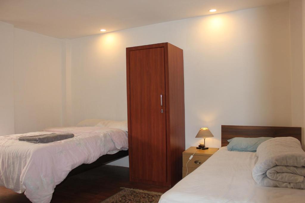 Postel nebo postele na pokoji v ubytování KAJI HOME