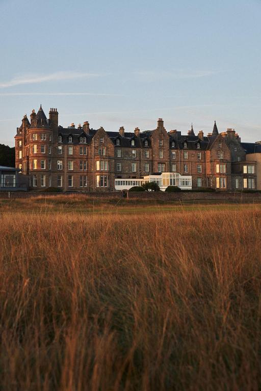 a large building in front of a field of grass at Marine North Berwick in North Berwick