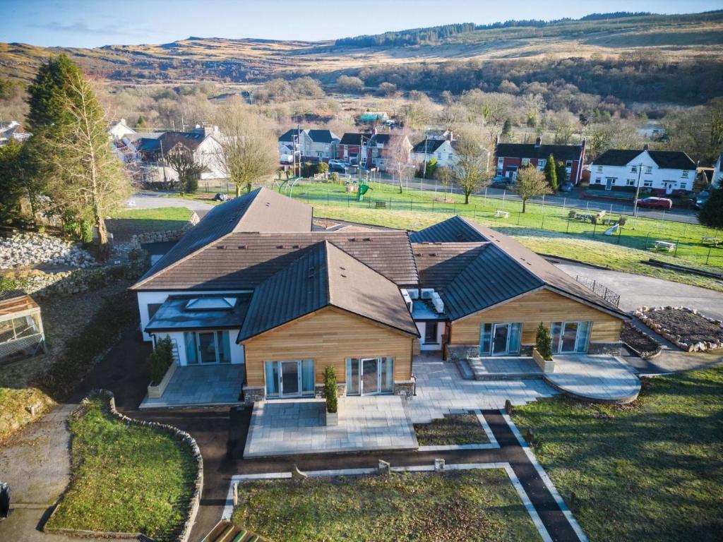 an aerial view of a house with a yard at Suite 12 - Sleeping Giant Hotel - Pen Y Cae Inn in Brecon