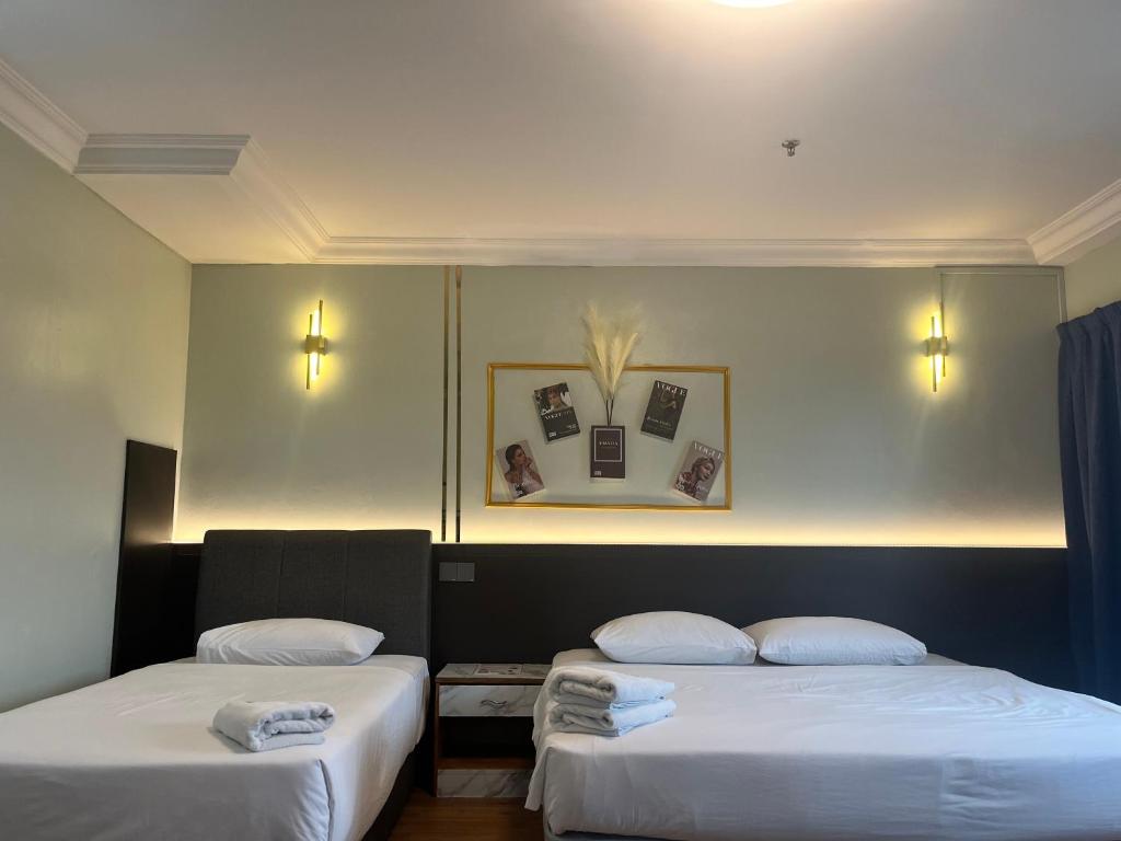 Postel nebo postele na pokoji v ubytování Fair Park Hotel