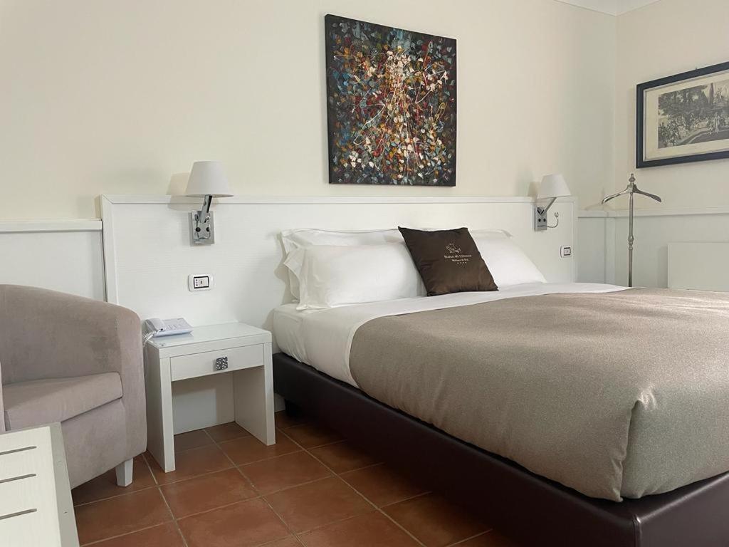 Postel nebo postele na pokoji v ubytování Baia Di Ulisse Wellness & Spa