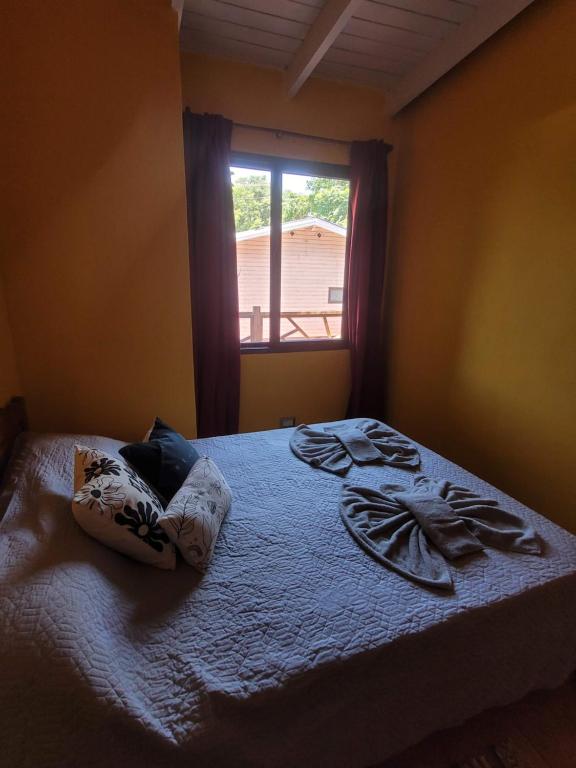 Postel nebo postele na pokoji v ubytování Ombú Guests House
