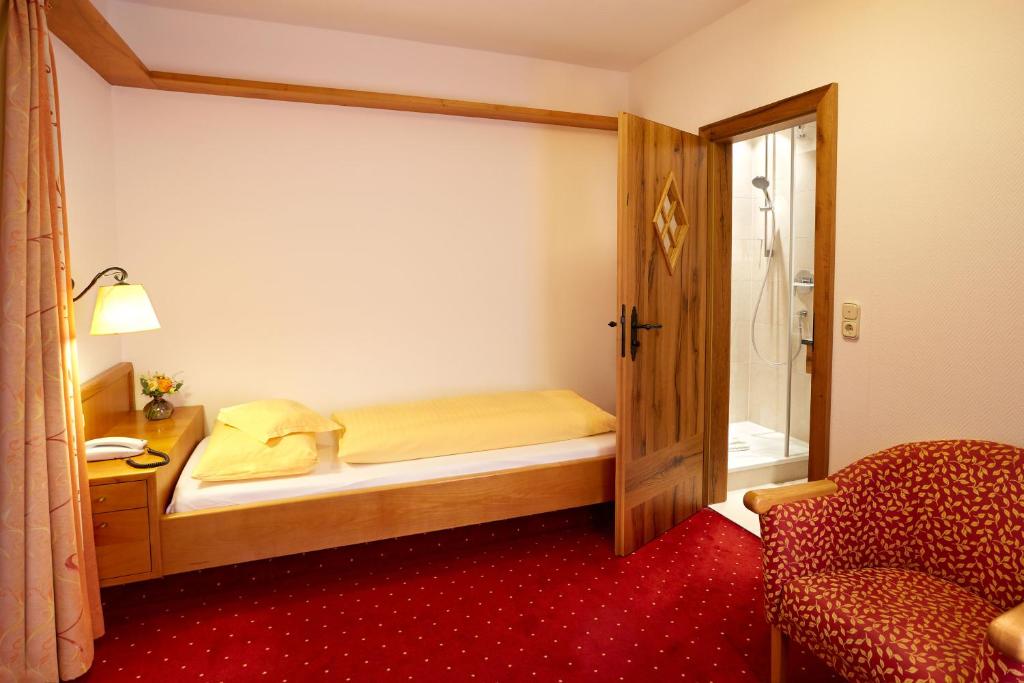 Postel nebo postele na pokoji v ubytování Kurhotel Eichinger