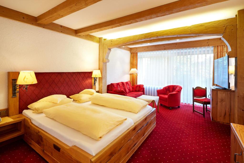 Postel nebo postele na pokoji v ubytování Kurhotel Eichinger
