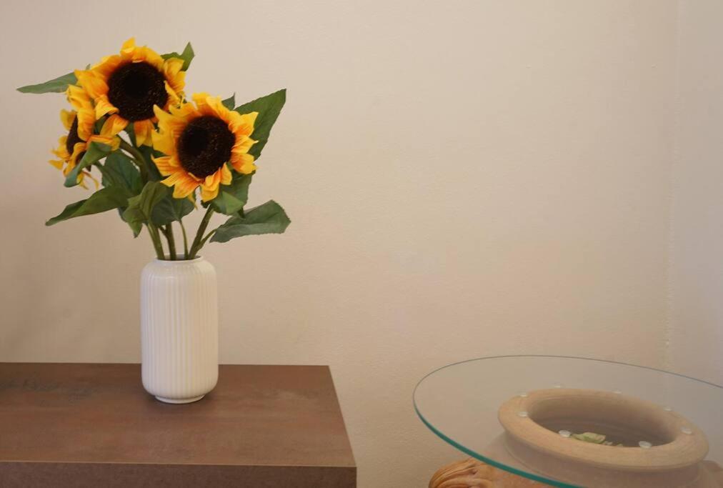 a vase filled with sunflowers sitting on a table at Il Girasole in Trebiano