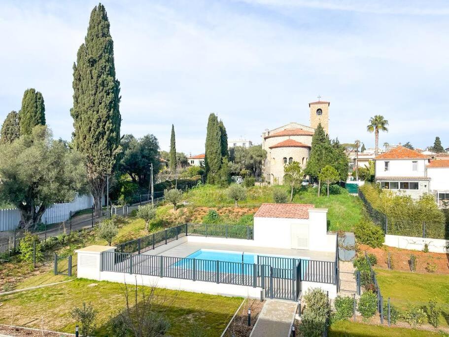 an aerial view of a house with a swimming pool at Jardin Secret YourHostHelper in Antibes