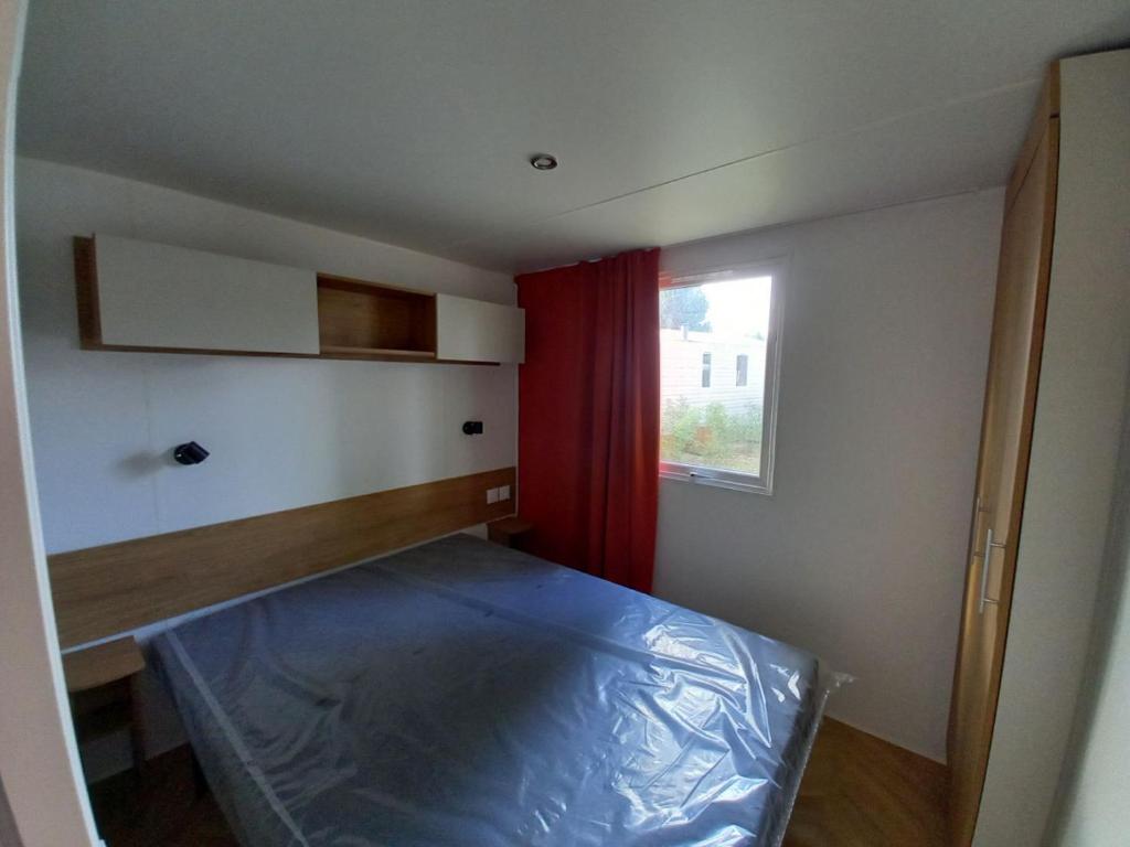 Postel nebo postele na pokoji v ubytování mobile home for you Les Rives de Condrieu