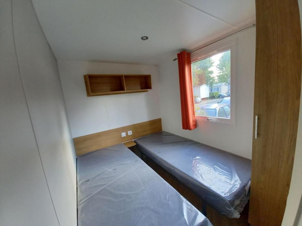 Postel nebo postele na pokoji v ubytování mobile home for you Les Rives de Condrieu