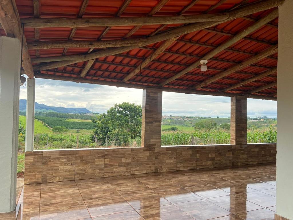 a room with a large window with a view at Rancho São Francisco in São Roque de Minas