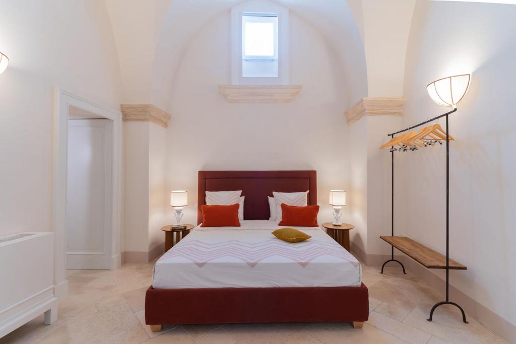 Postel nebo postele na pokoji v ubytování Palazzo Matteo