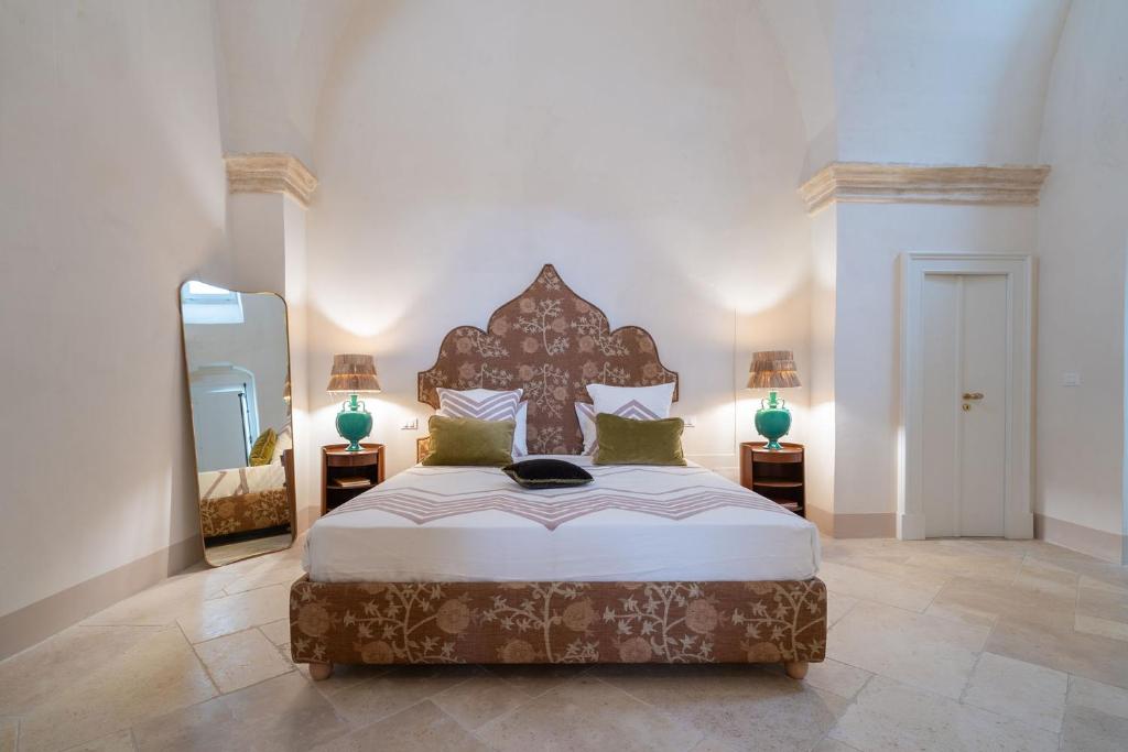 Postel nebo postele na pokoji v ubytování Palazzo Matteo