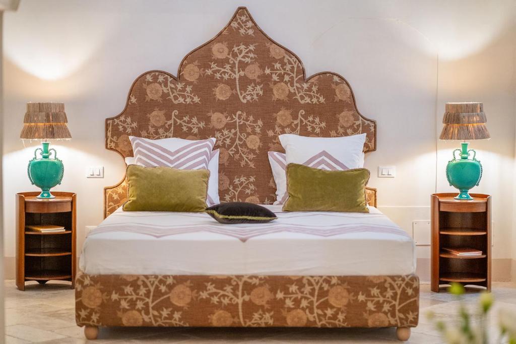 Postel nebo postele na pokoji v ubytování Palazzo Matteo