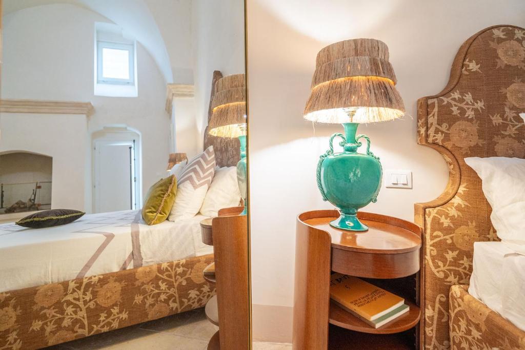 Postel nebo postele na pokoji v ubytování Palazzo Matteo
