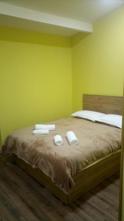 a bedroom with a bed with two towels on it at Sauna hotel in Poti