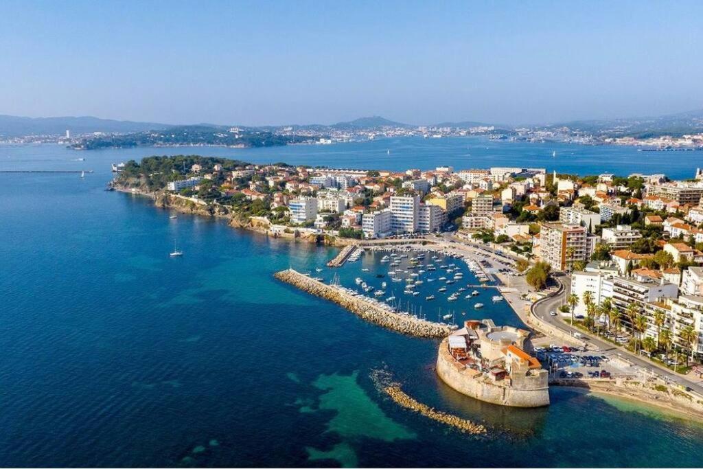 an aerial view of a harbor with boats in the water at Appartement T1 cosy neuf in Toulon