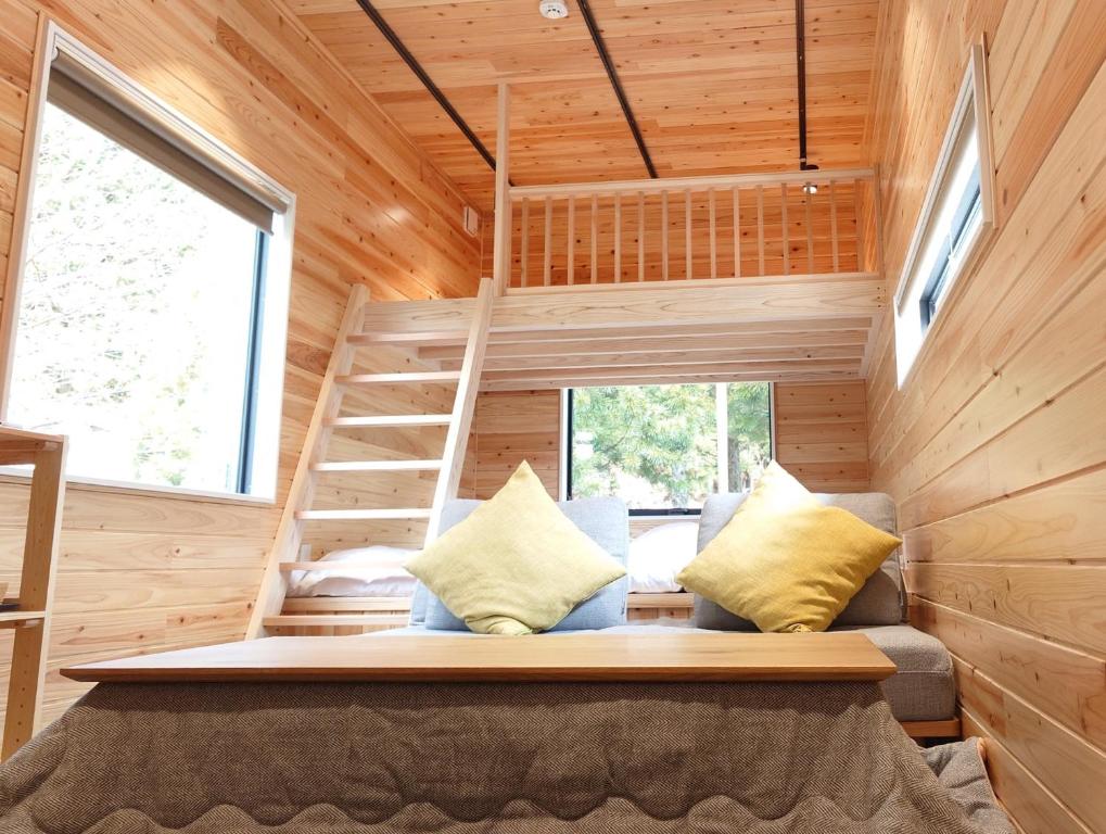 a tiny house with a bunk bed and a ladder at CampBaseKadojin - Vacation STAY 33535v in Tenkawa