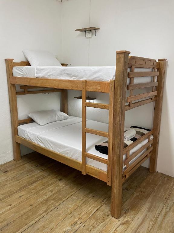 Postel nebo postele na pokoji v ubytování Origen Hostel Jardín