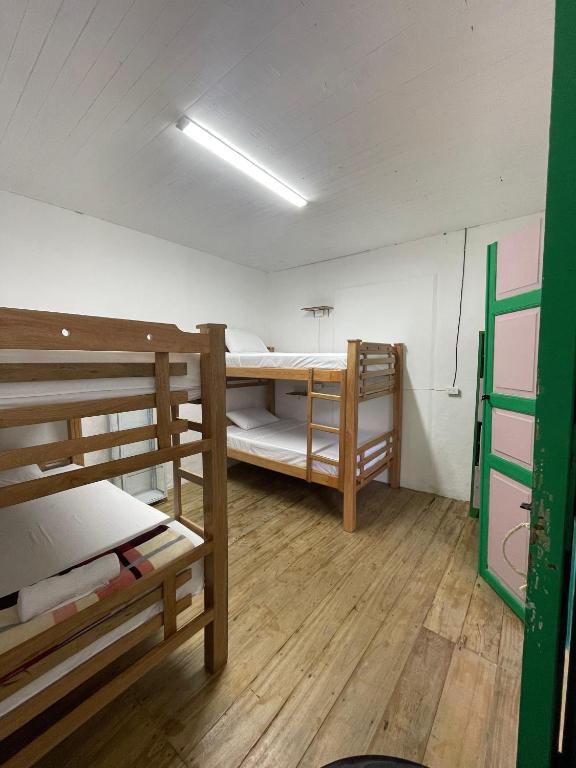 Postel nebo postele na pokoji v ubytování Origen Hostel Jardín