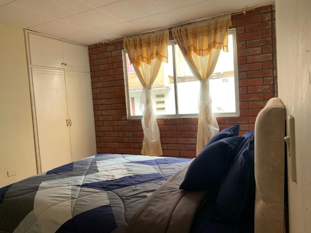 Postel nebo postele na pokoji v ubytování Dulce Hogar 01