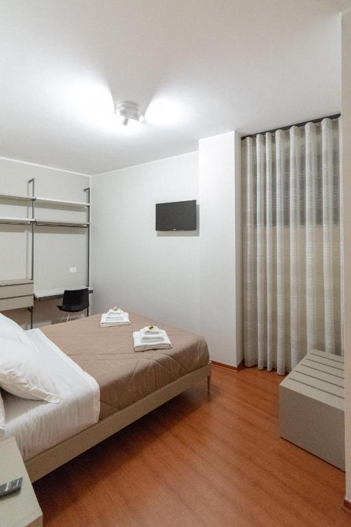 Postel nebo postele na pokoji v ubytování B&B Il Mercantello