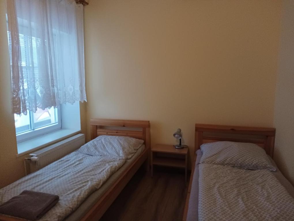 Postel nebo postele na pokoji v ubytování Hostinec Peterka