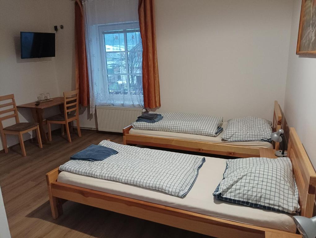 Postel nebo postele na pokoji v ubytování Hostinec Peterka