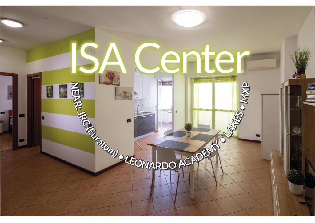 a room with a table and a sign that reads is a center at Isa Center - Leonardo Accademy - MXP - Lakes in Sesto Calende