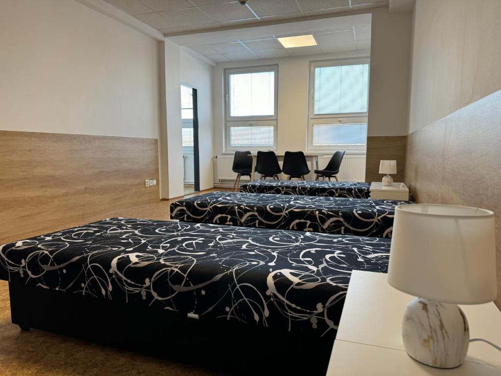 Postel nebo postele na pokoji v ubytování D8 APARTMÁNY