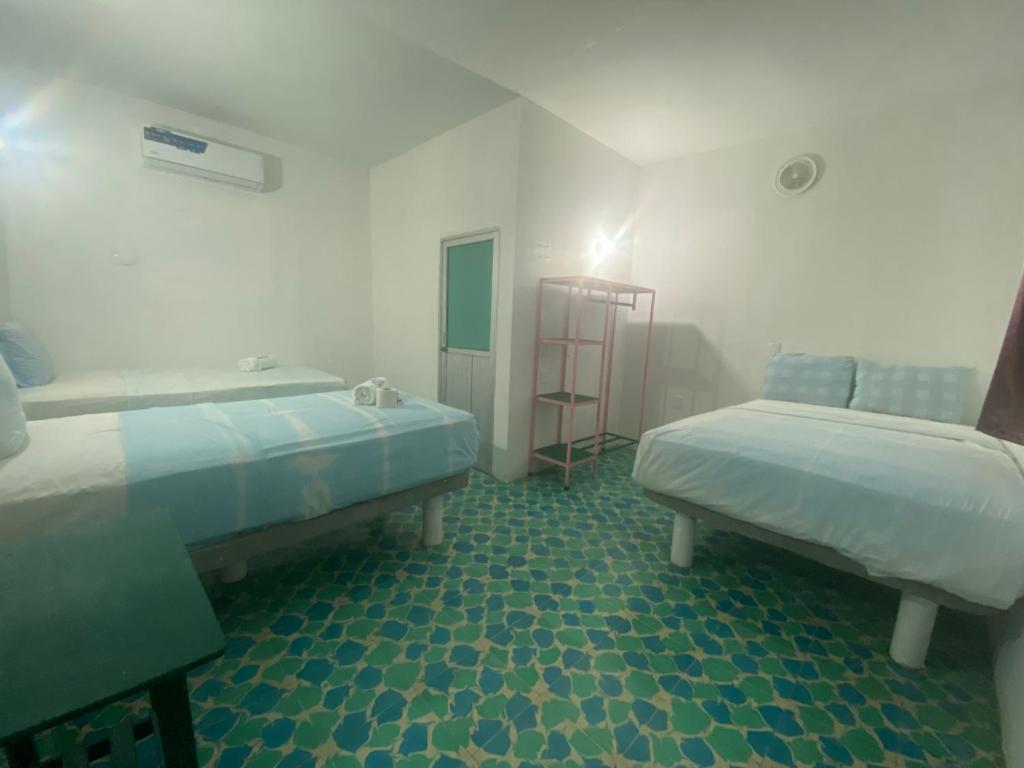Postel nebo postele na pokoji v ubytování Hotel Casa Cactus HCC