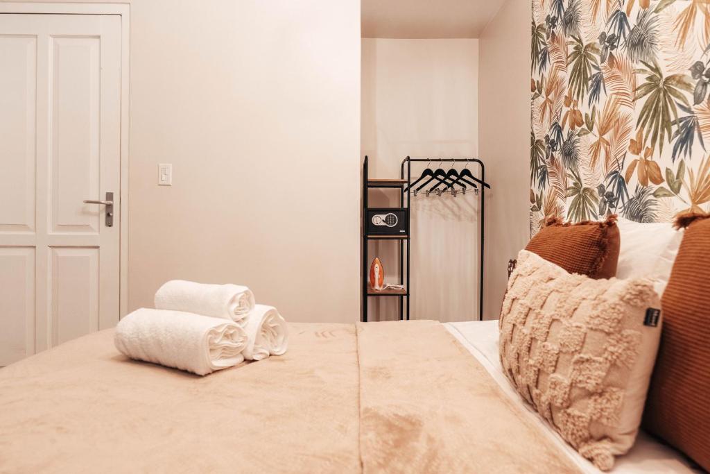 Postel nebo postele na pokoji v ubytování Atelier Skalo Boutique Hotel