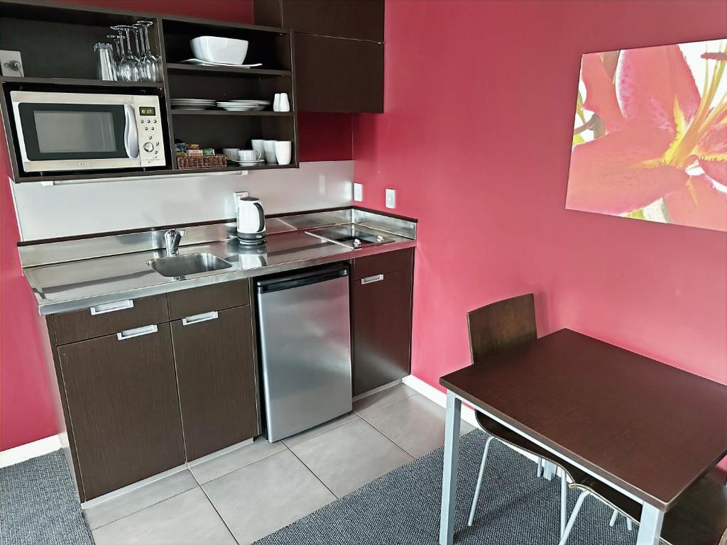 Kuchyň nebo kuchyňský kout v ubytování Arena Lodge