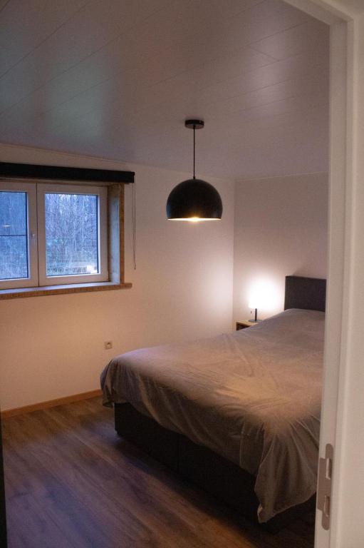 Vakantiewoning 't Bruggeneindje 객실 침대