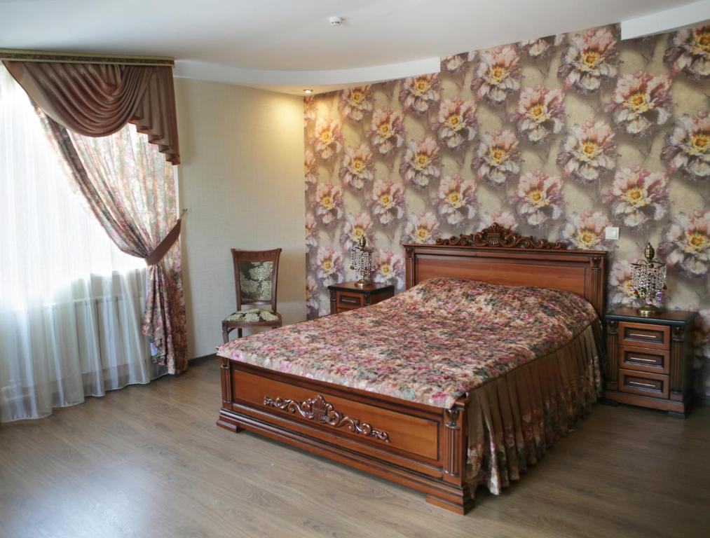 Кровать или кровати в номере Бутик-отель  «Три Богатыря»
