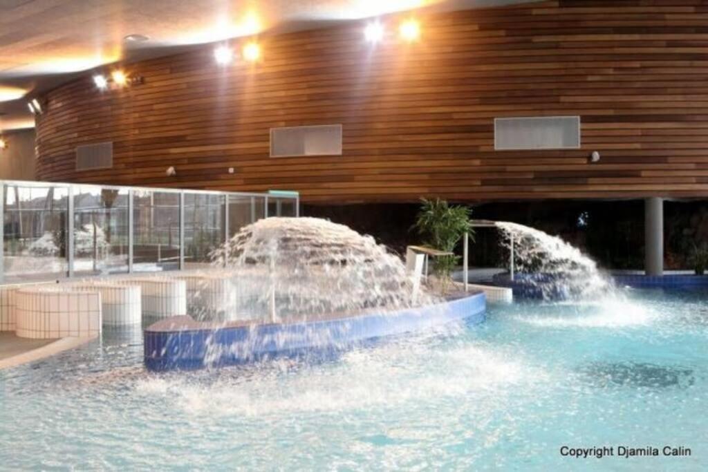 two water fountains in a pool in a building at F4 - Duplex spacieux proche d'Orly in Athis-Mons