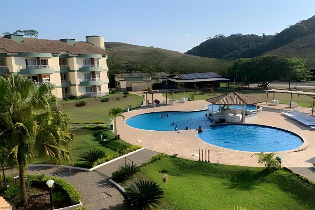 Piscina de la sau aproape de Luxuoso Apart Hotel Village c/ vista para piscina