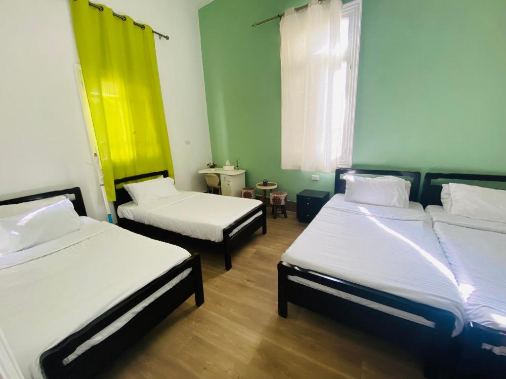 Postel nebo postele na pokoji v ubytování City Hostel Dormitory