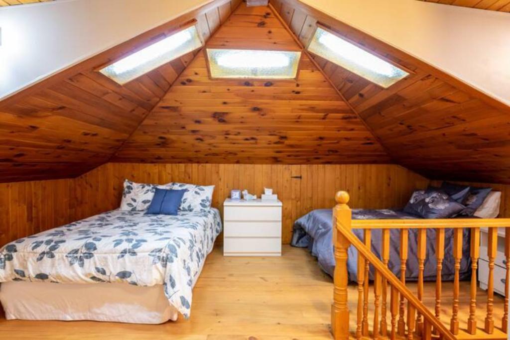 Postel nebo postele na pokoji v ubytování Les chalets labbé