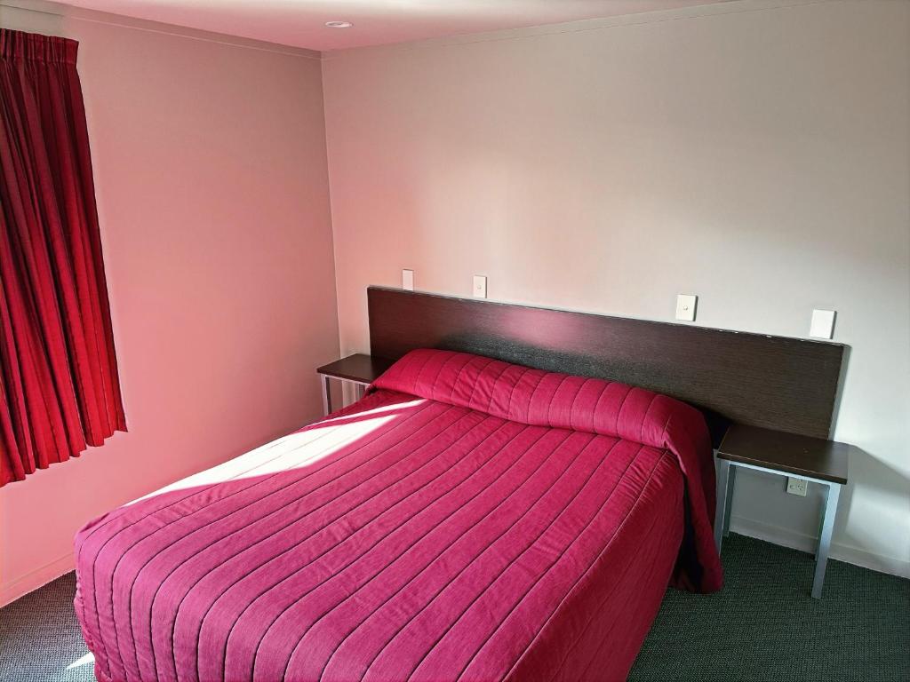 Postel nebo postele na pokoji v ubytování Arena Lodge