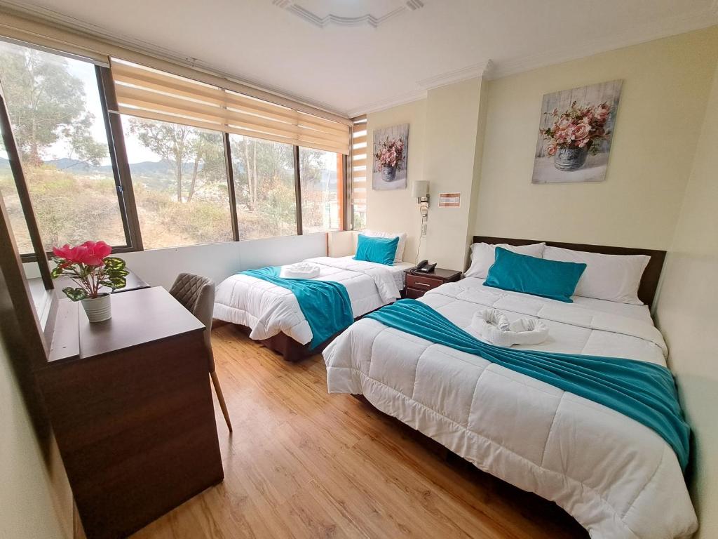 Postel nebo postele na pokoji v ubytování Hotel Loja Bella