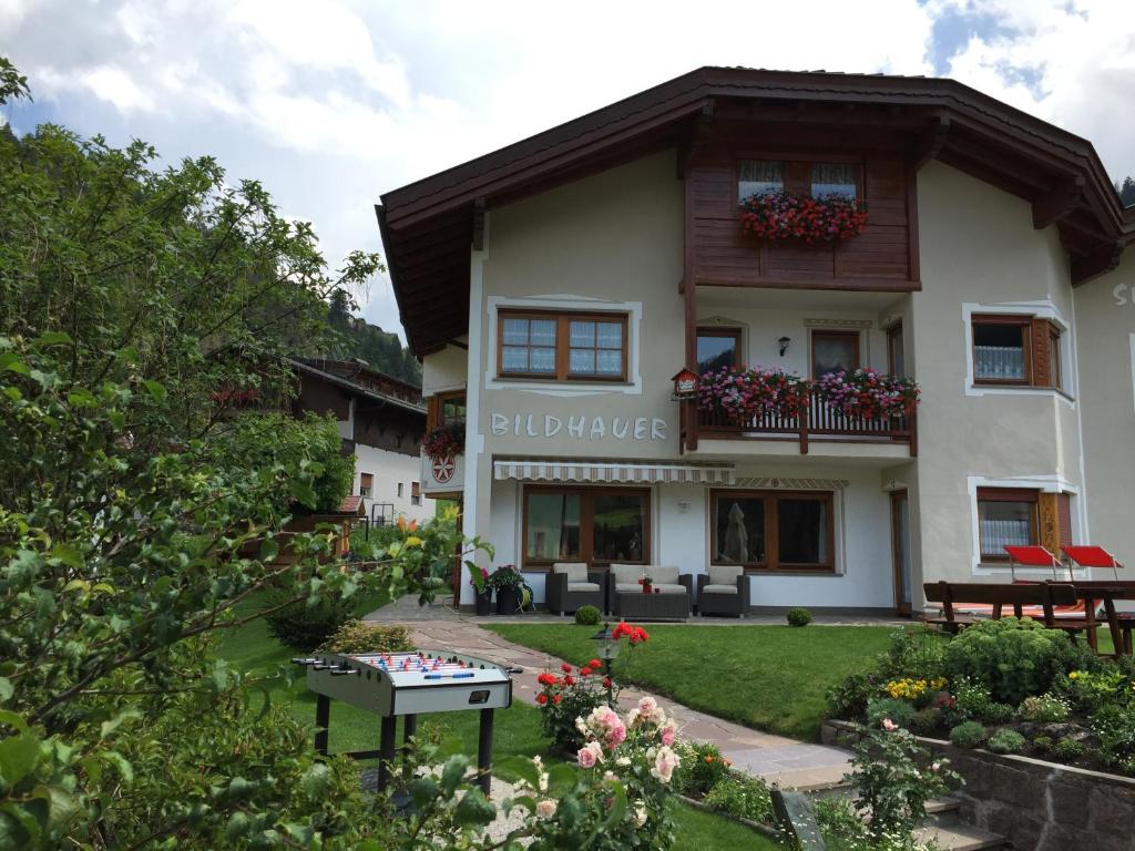 a house with a garden in front of it at Apartment Ruiel in Santa Cristina Gherdëina