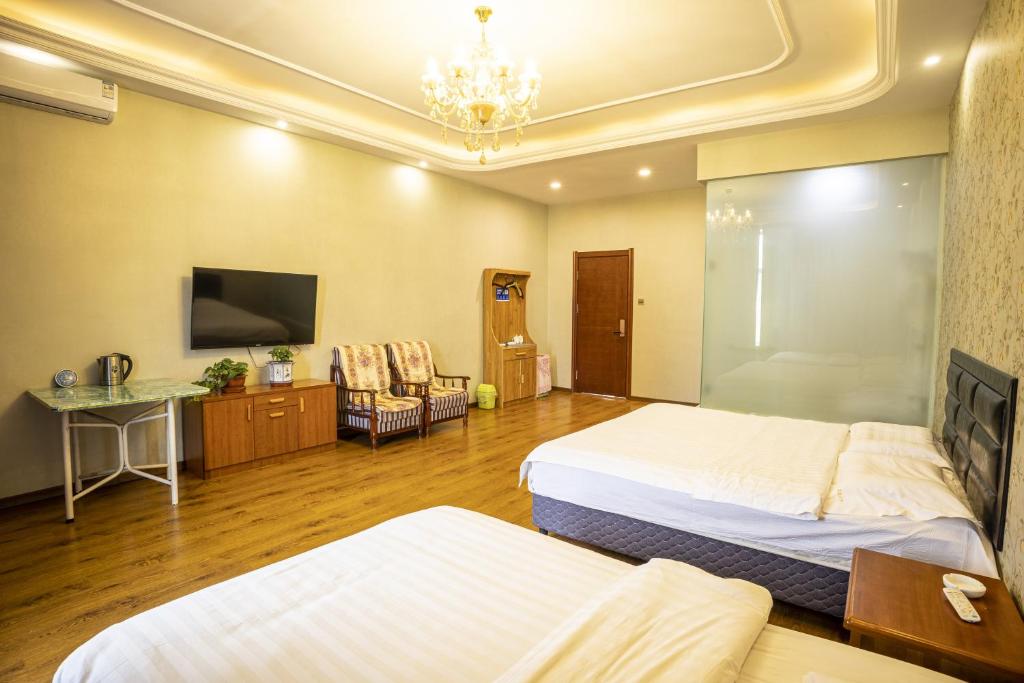 Postel nebo postele na pokoji v ubytování Harbin Binpeng Inn - Harbin Taiping International Airport