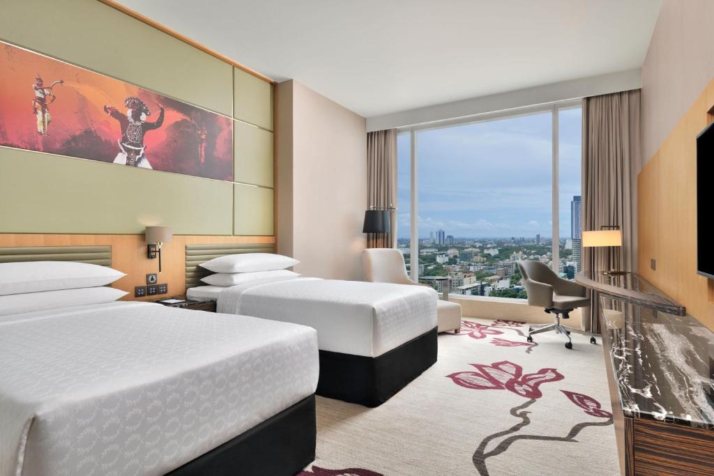 Postel nebo postele na pokoji v ubytování Sheraton Colombo Hotel
