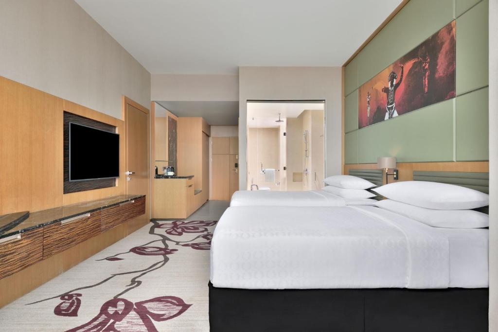 Postel nebo postele na pokoji v ubytování Sheraton Colombo Hotel