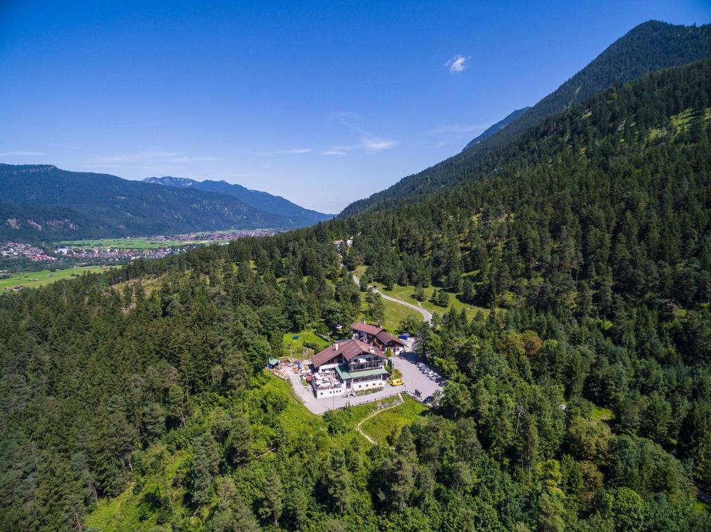 an aerial view of a large house in the middle of a forest at Landhotel Panorama in Garmisch-Partenkirchen