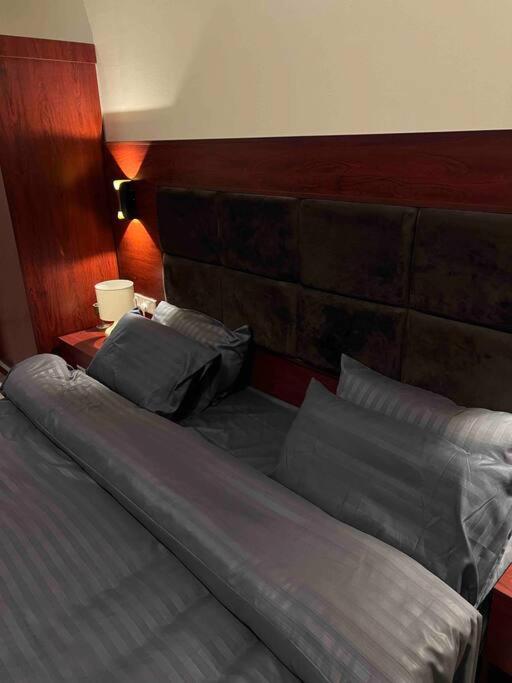 a bed with two pillows on it in a bedroom at شقة سكنية بغرفتين نوم in Al Jubail