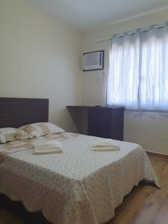 Postel nebo postele na pokoji v ubytování Pousada J L